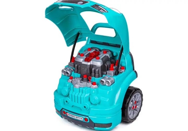 Turkusowy **zestaw małego mechanika** z otwartą maską, ukazujący plastikowy silnik z czerwonymi elementami i śrubami.
