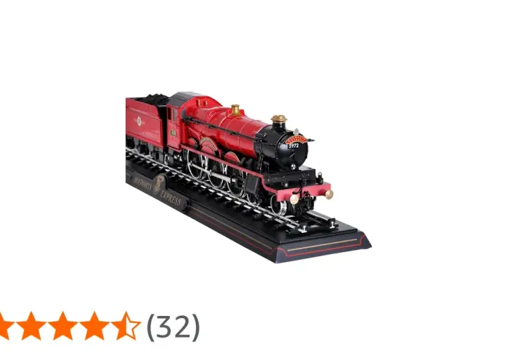 Model czerwonego pociągu Hogwarts Express na czarnym torowisku z napisem "HOGWARTS EXPRESS".