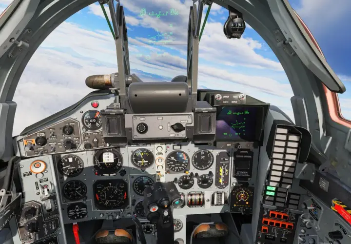 Widok z kokpitu myśliwca Mig-29. Wiele wskaźników i ekranów wyświetla dane lotu.