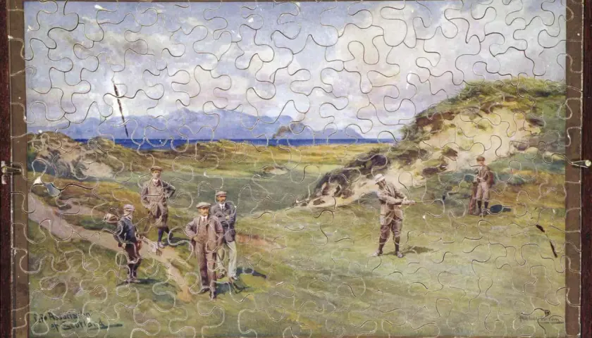 Kto wymyślił puzzle? Obraz przedstawia grę w golfa na wybrzeżu, z mężczyznami w strojach z epoki.