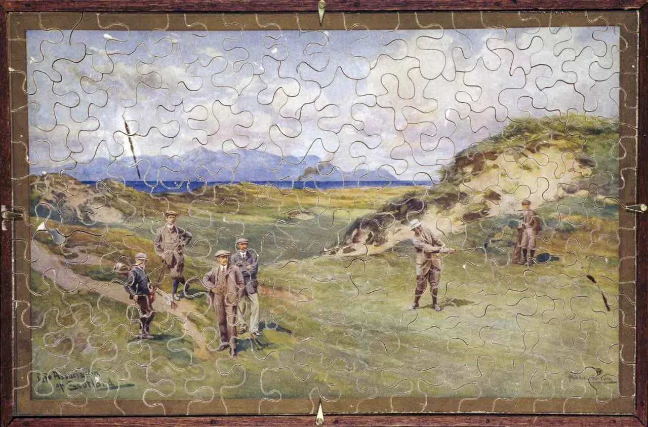 Kto wymyślił puzzle? Obraz przedstawia grę w golfa na wybrzeżu, z mężczyznami w strojach z epoki.