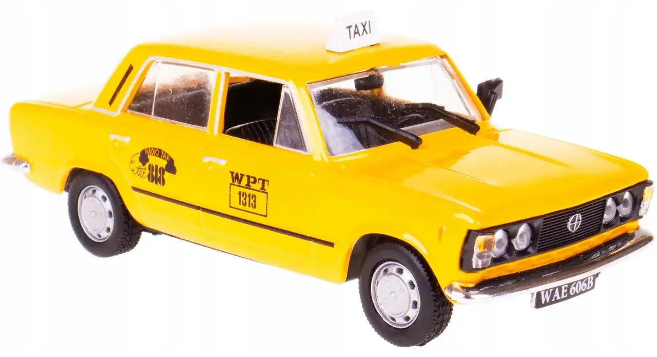 Ż&oacute;łty fiat 125p taxi z napisem 
