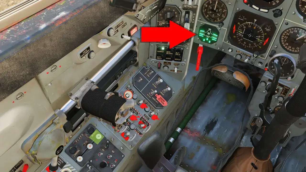Wnętrze myśliwca MiG-29 z widocznymi wskaźnikami i przełącznikami. Czerwona strzałka wskazuje na zielony wyświetlacz.